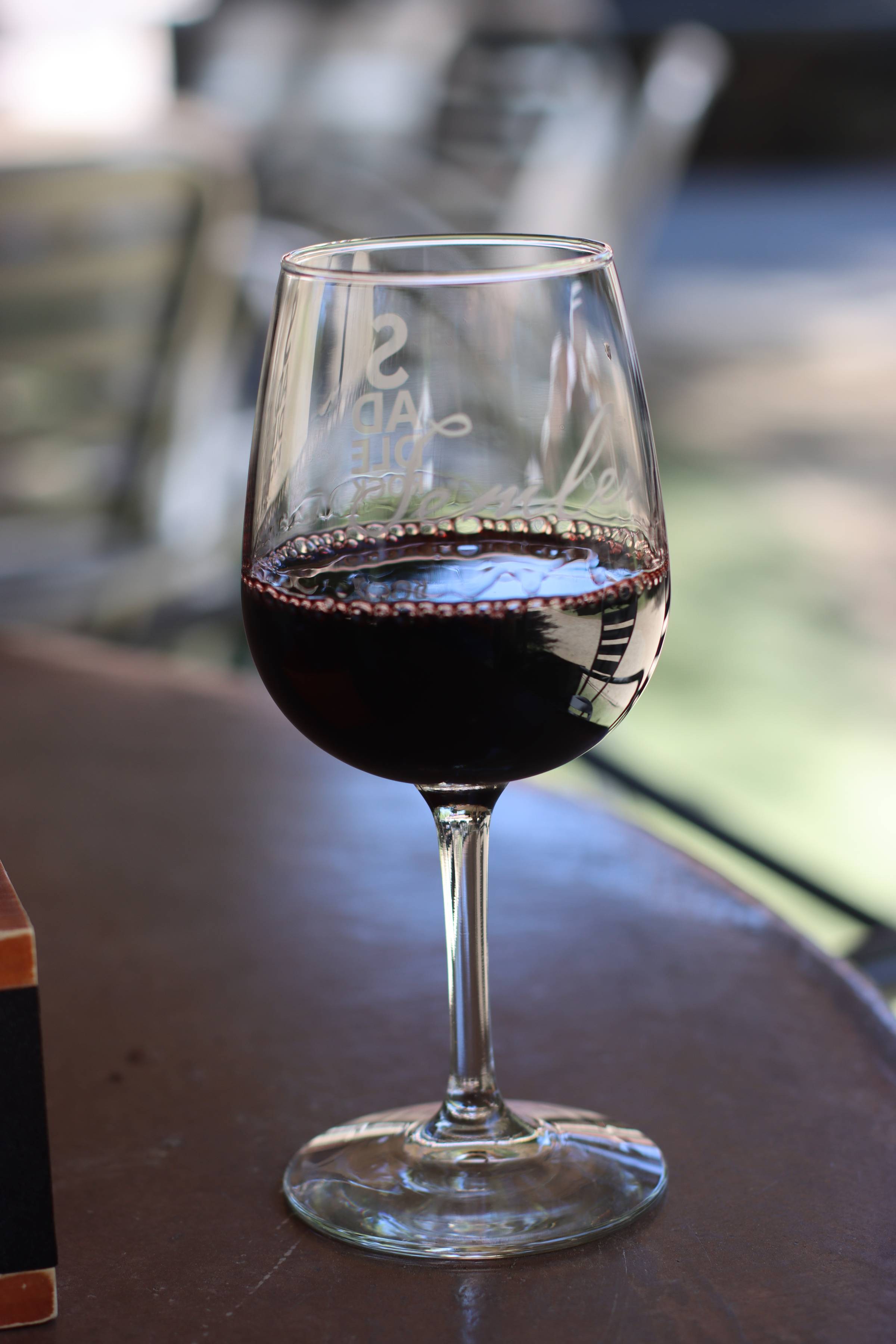 A glass of estate Cabernet on a patio table