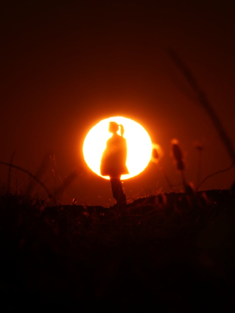 A person holding the light inside