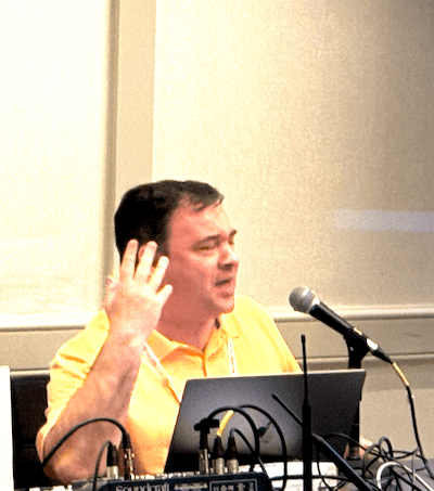 Simon Miner speaks at CSUN 2025 about building empathy to drive accessibility initiatives. Photo by Chelsea Nguyen.