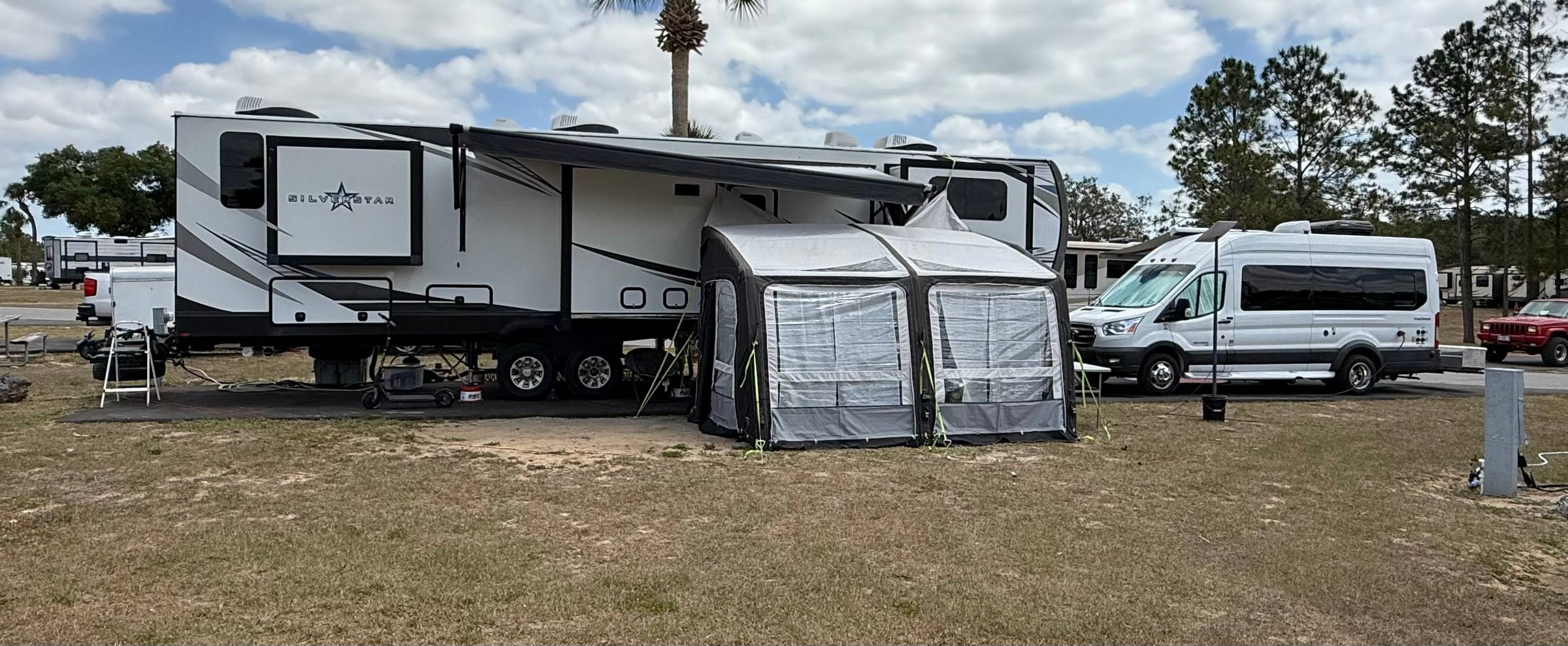 Team Human RV campsite with van and fifth wheel