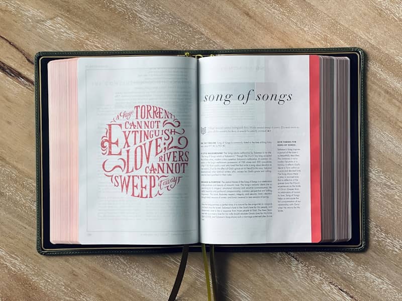 Open bible, with "song of songs" displayed.