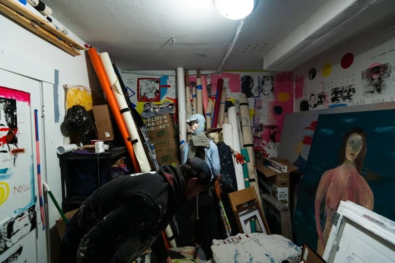 a room filled with lots of art and paintings
