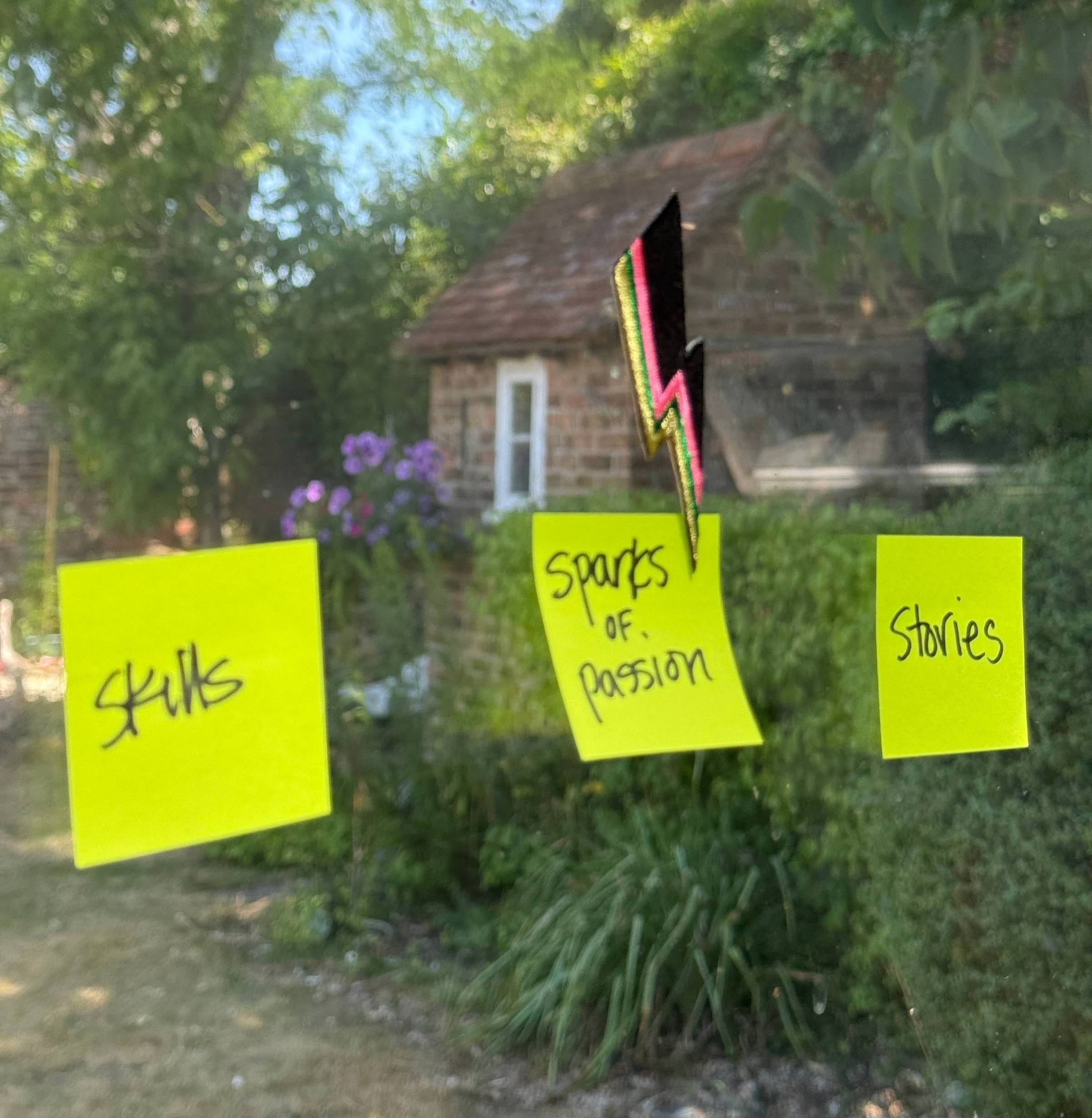 sticky notes on a window that say "Skills", "Sparks of passion", and "Stories"