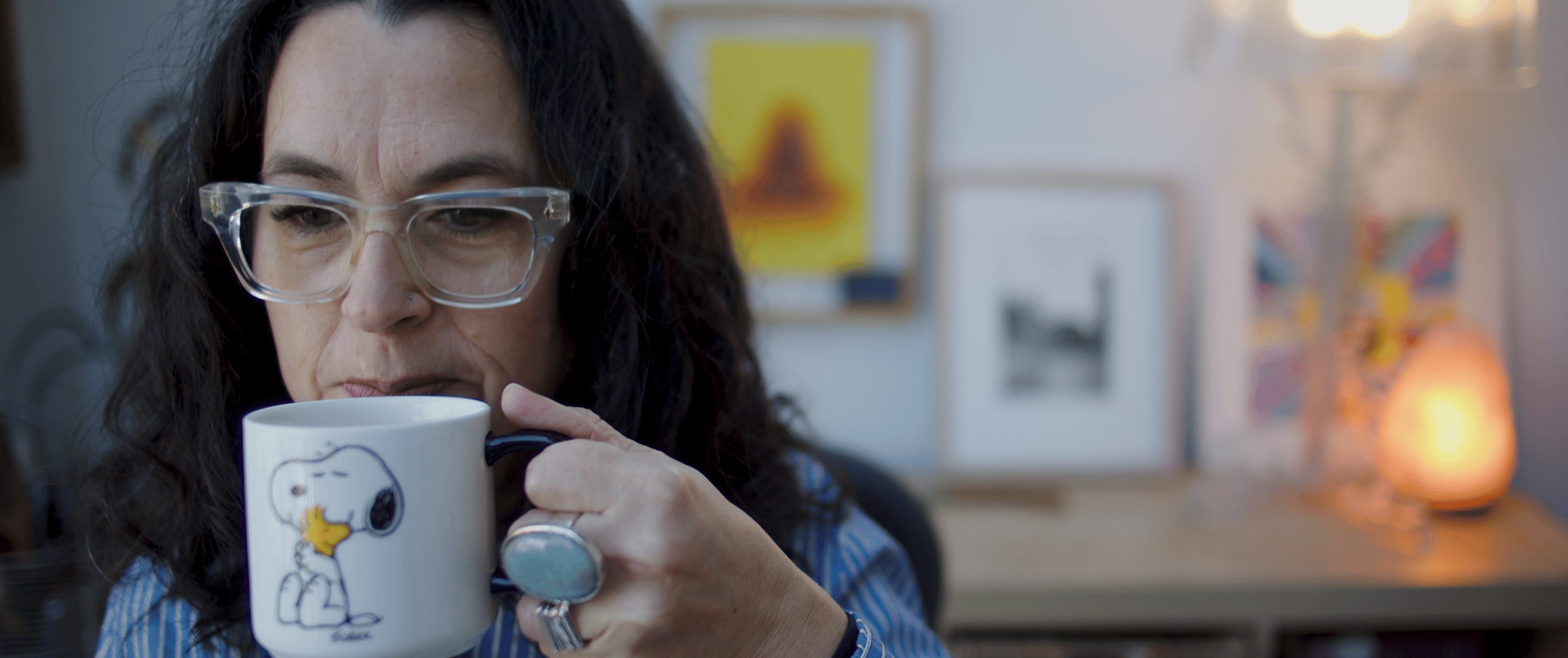 photo of Louise drinking tea from her Snoopy mug