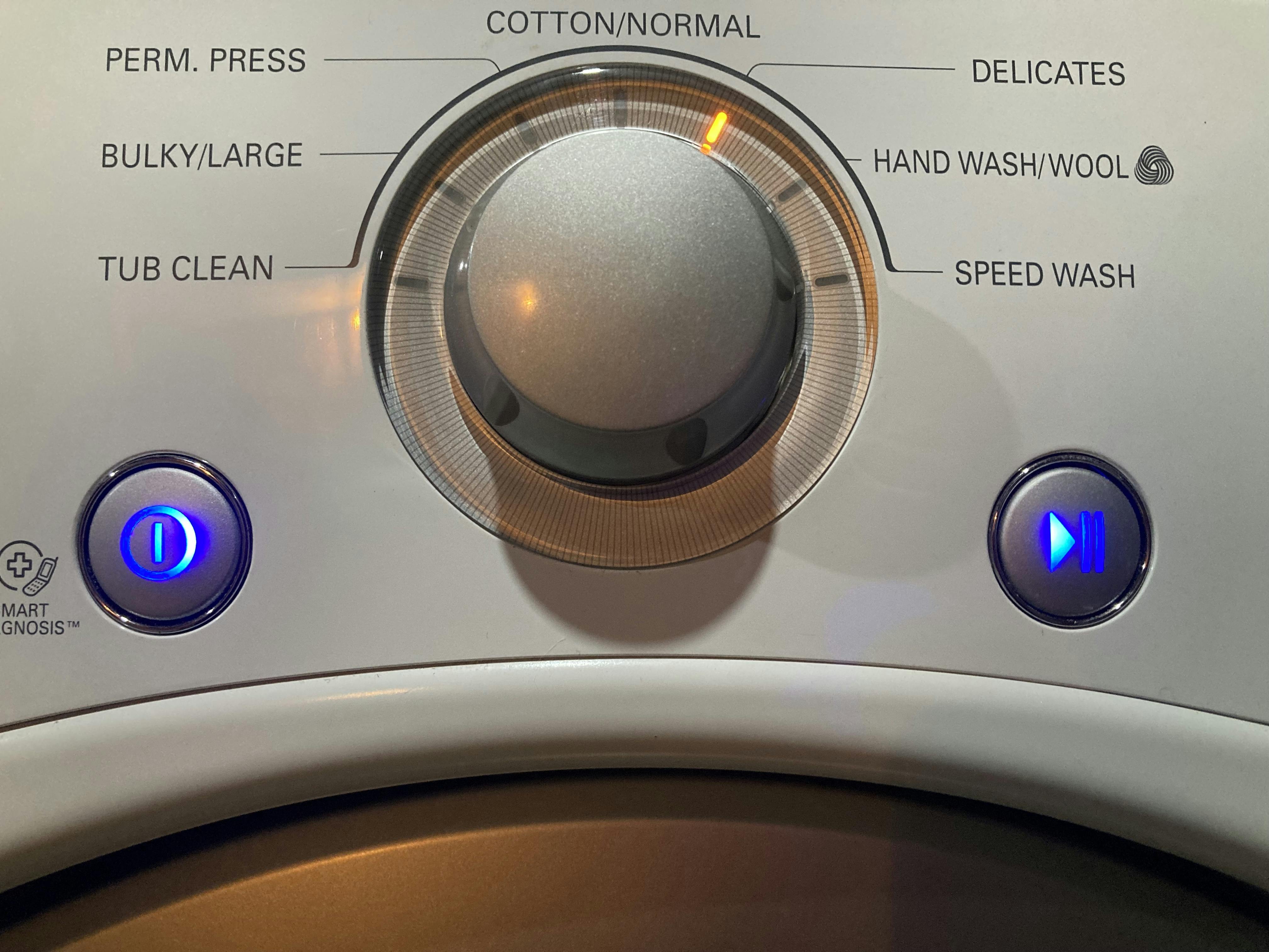 A photo of a washing machine setting dial, set to delicates