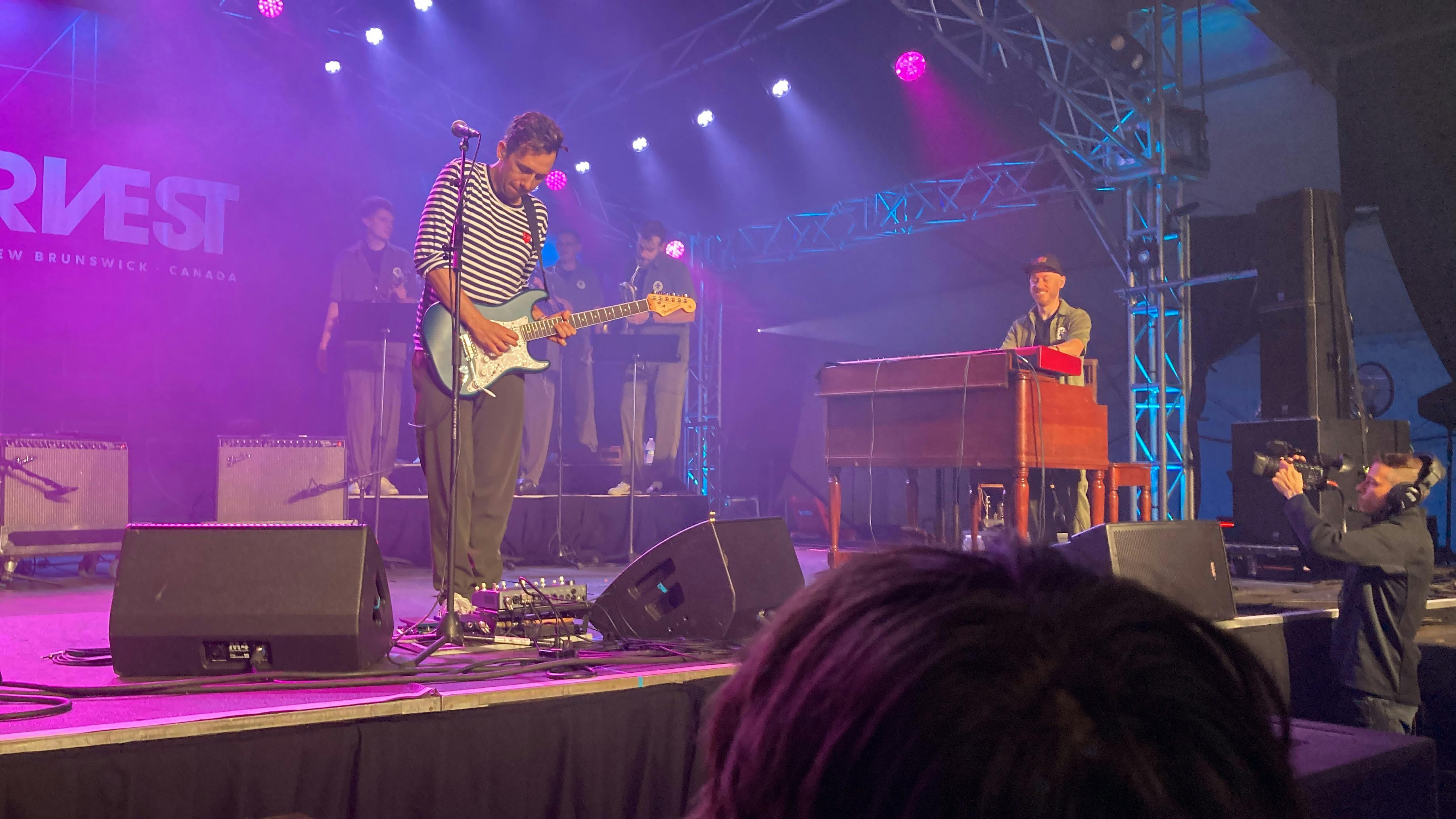 A photo of Cory Wong, the guitarist, playing live in Fredericton, New Brunswick at Harvest 2023