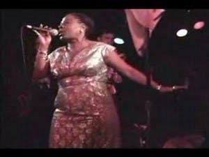 A photo of the late, great Sharon Jones singing with the Dap-Kings in 2005.