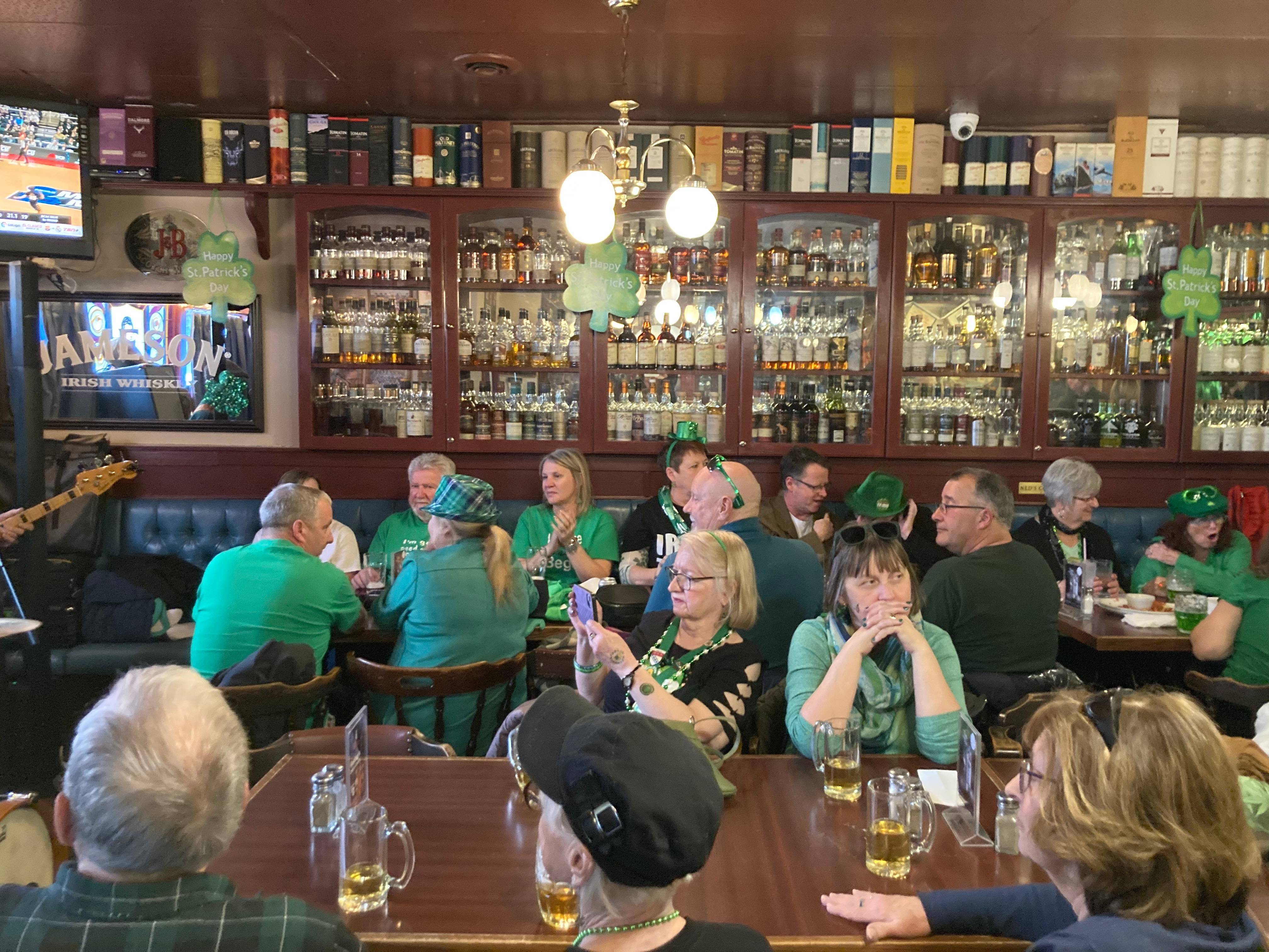 A lot of middle-aged people watching a concert at a pub on St. Patrick's Day in Fredericton, NB.