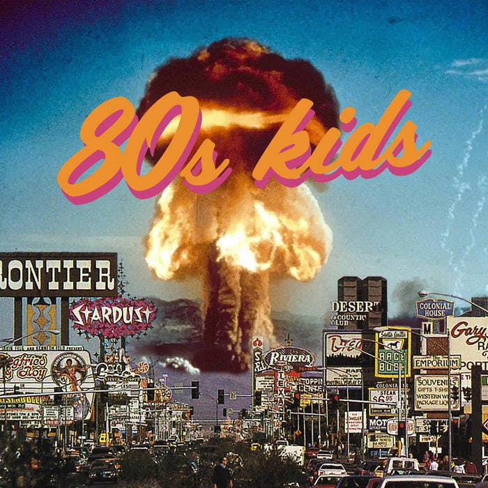 The cover art for Shannon Curtis' 80s kids album, showing an explosion in the background of an 80s streetscape (maybe Las Vegas?)