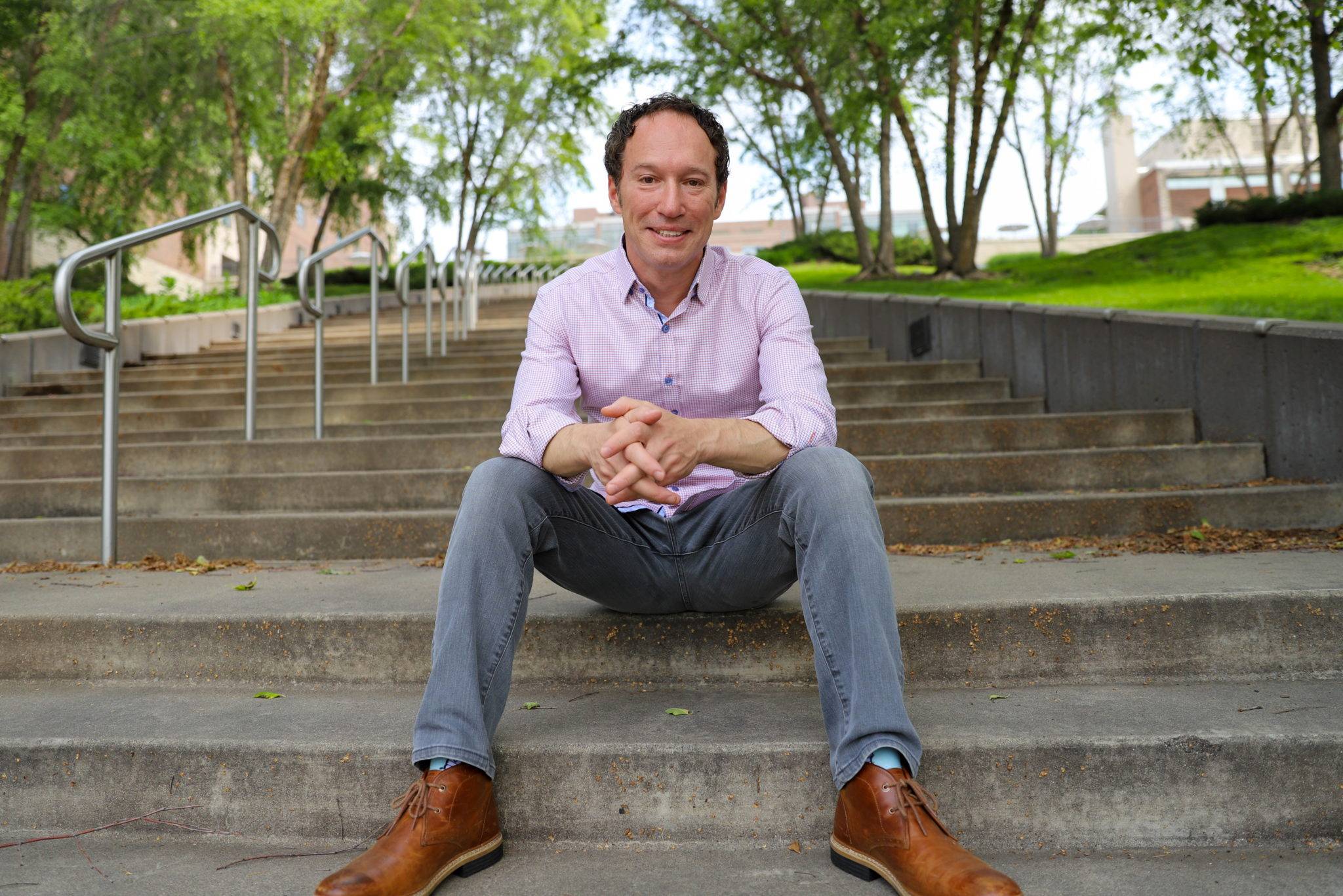 Kevin Freidberg, sitting on stairs