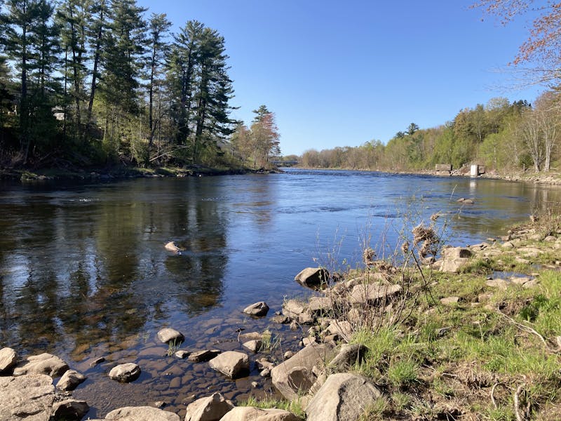 A picture looking out across a river from the shore