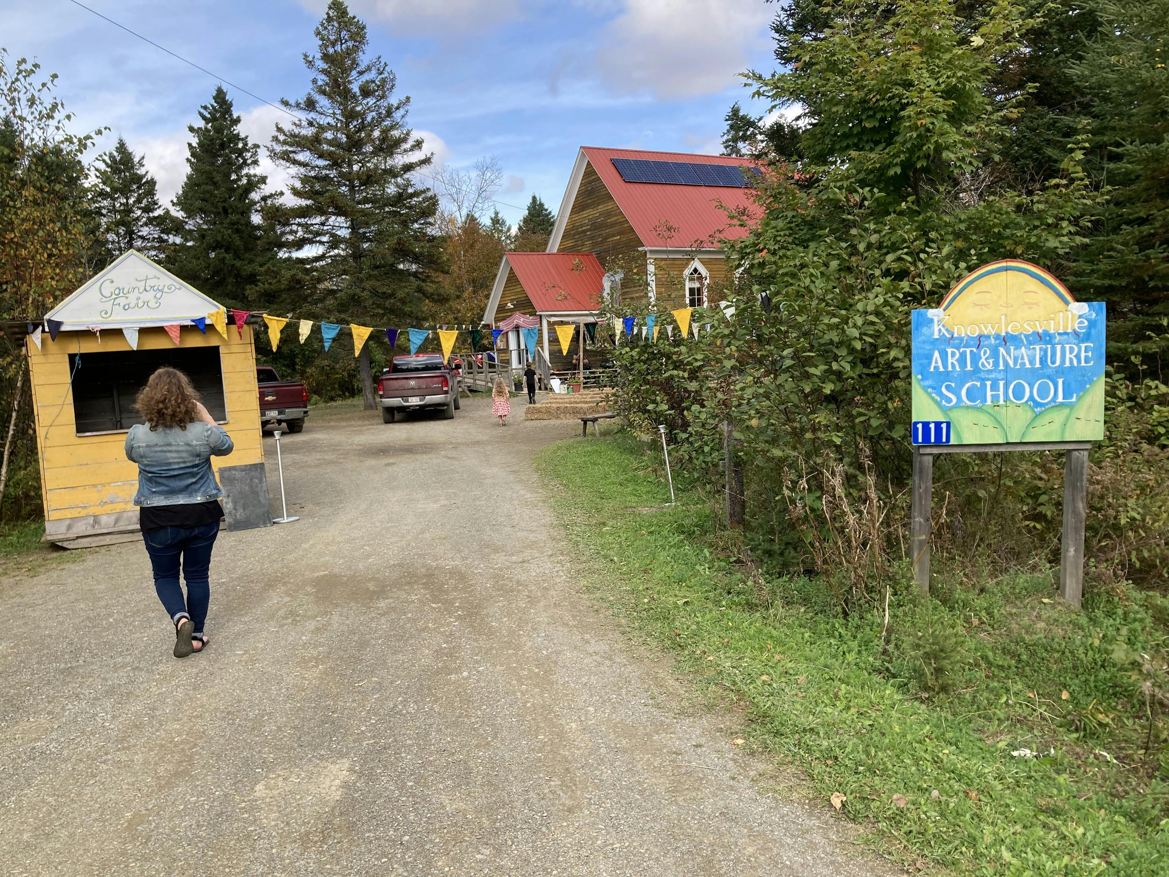 A photo of the entryway to the Knowlesville Art and Nature School in full Country Fair dress.