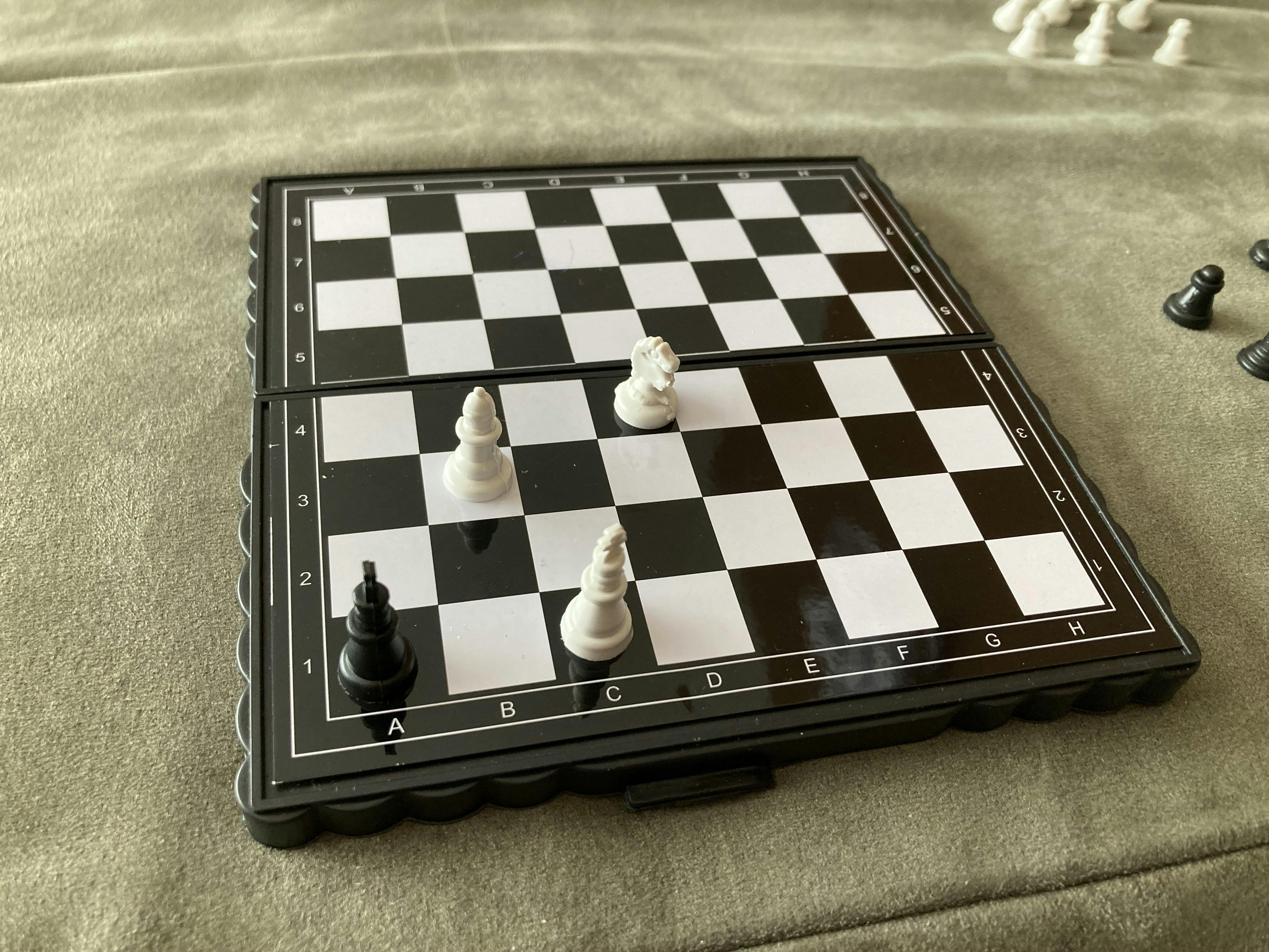 A picture of a chessboard with the game in a stalemate. Black is not in check, yet it cannot move or it will put itself into check.