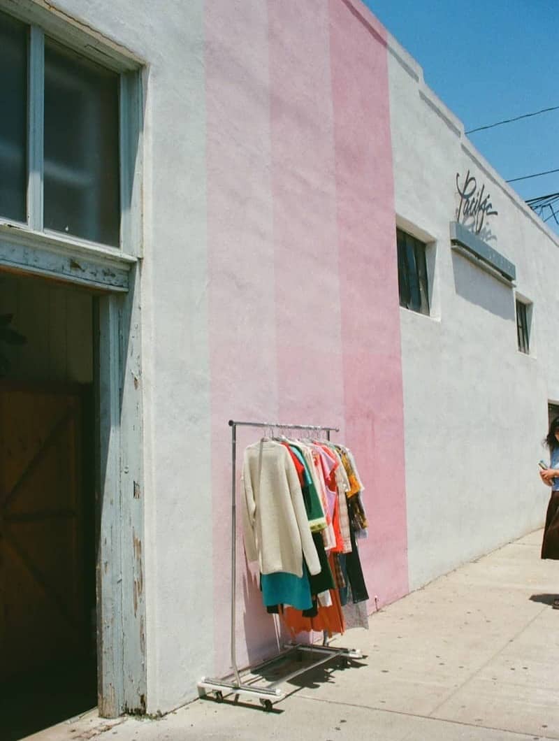 Clothes hanging on a rack outside a building