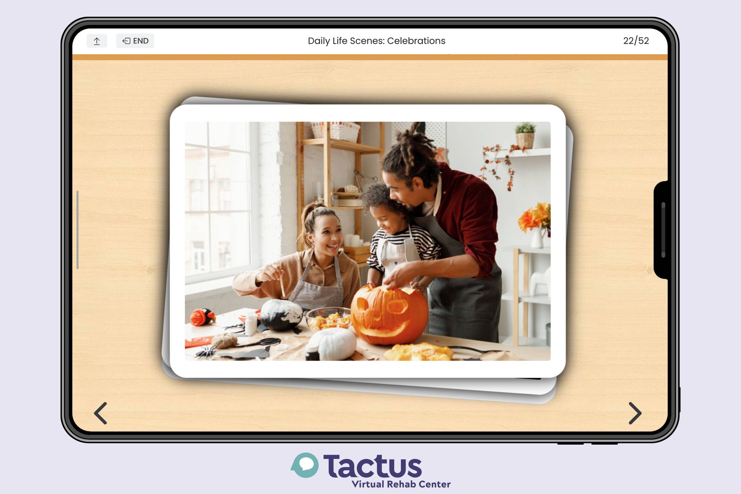 A flashcard with a photo showing a family carving a pumpkin and painting a pumpkin together