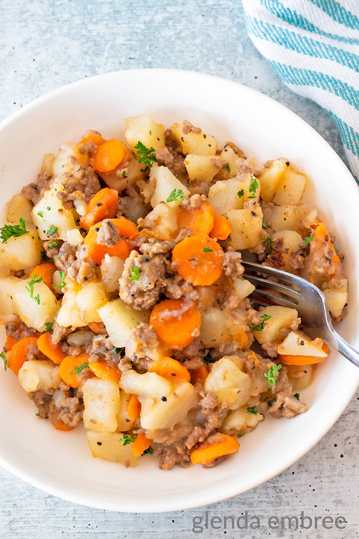 Hamburger Potato Casserole in a white bowl.