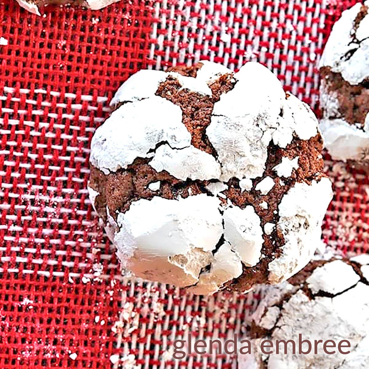 Chocolate Crinkle Cookie on red and white Christmas burlap.