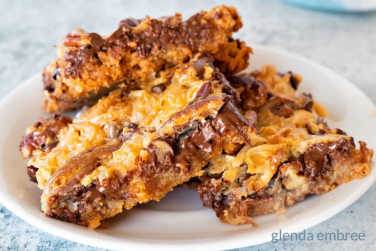 Magic Cookie Bars on a White Plate.