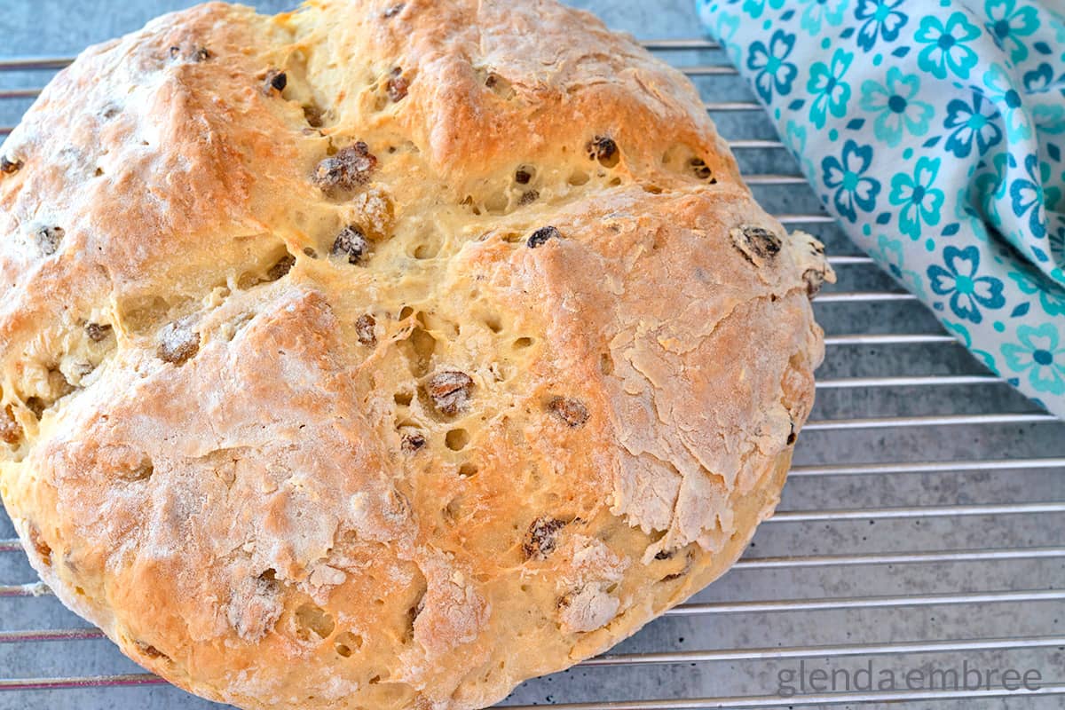  A loaf of soda bread cooling on a wire rack.