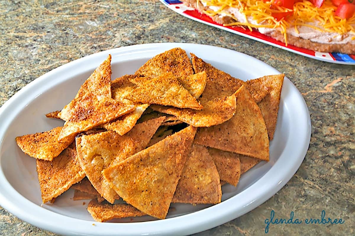 Homemade Taco Chips in a white bowl.