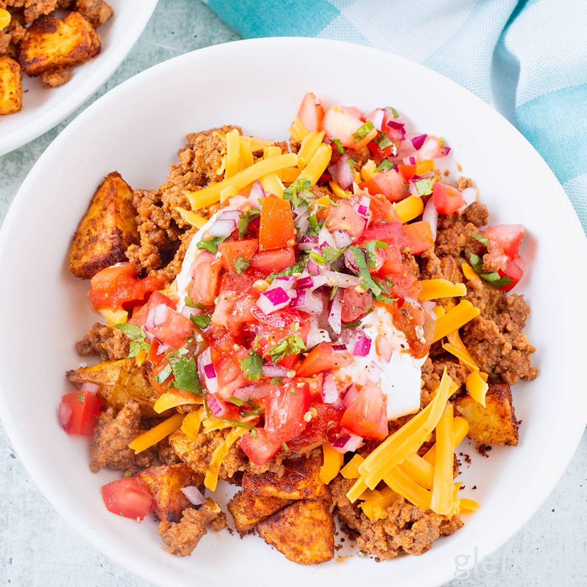 Taco Bowls with Taco Potatoes in a white ceramic bowl on a concrete countertop.