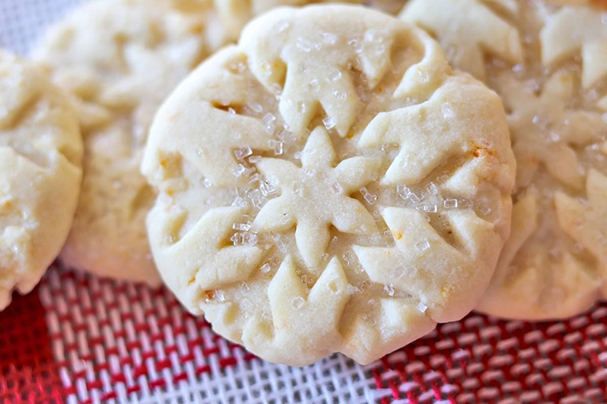 Easy Orange Shortbread Cookies on red and white holiday burlap.