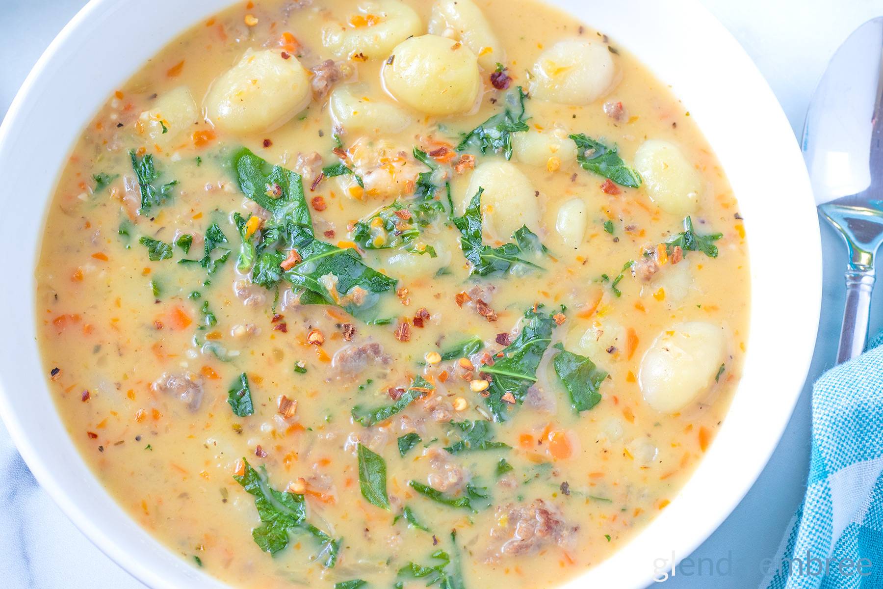 Sausage and Gnocchi Soup in a white ceramic bowl.