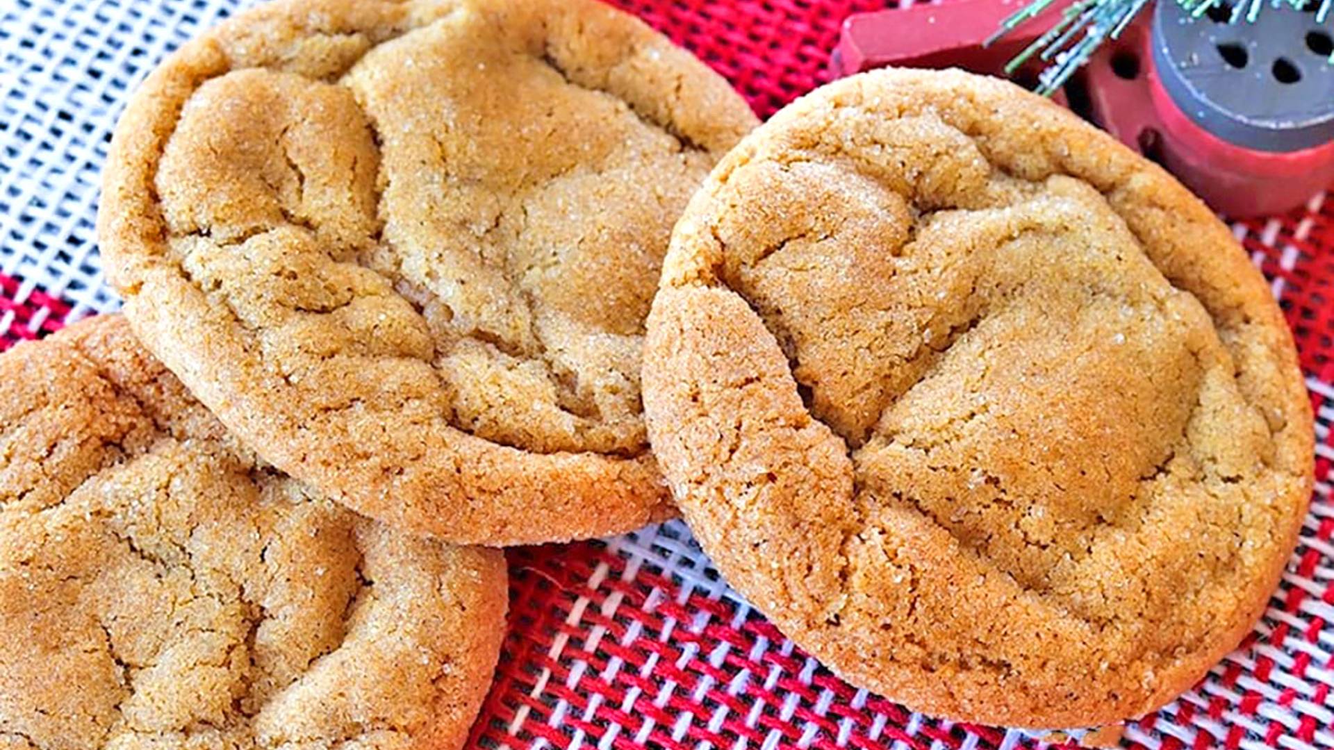 Ginger cookies on red and white holiday burlap.