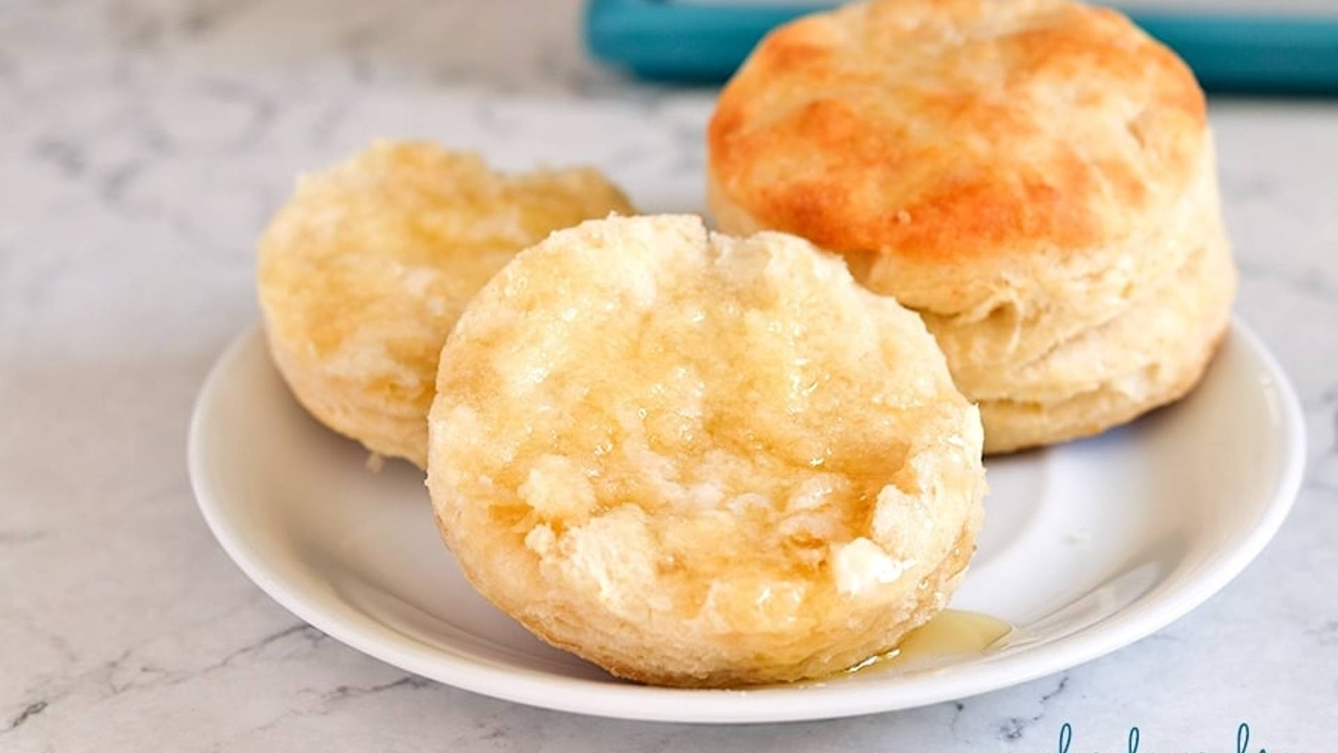 Homemade Biscuits on a white plate.