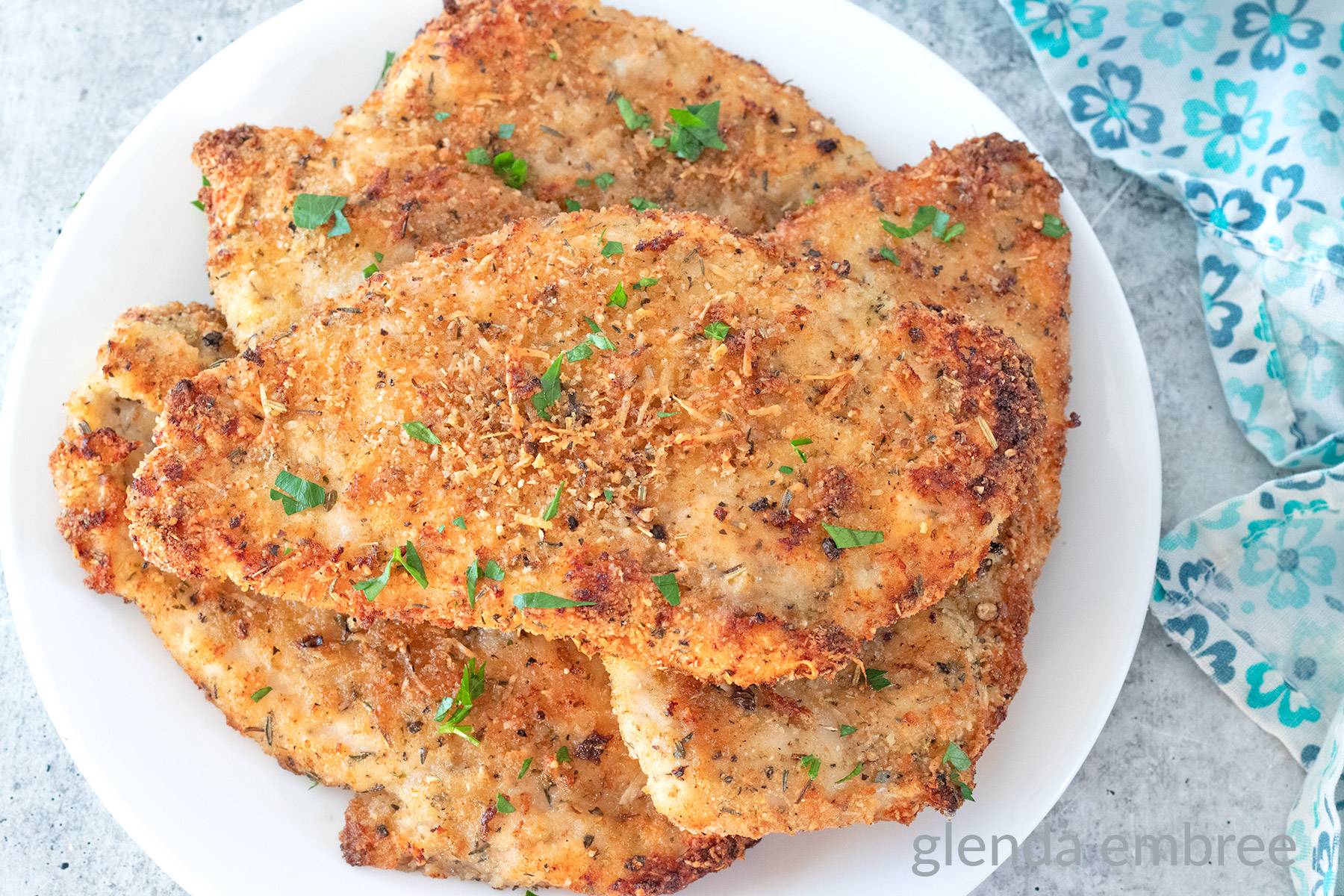 Italian Chicken Cutlets on a White Plate.
