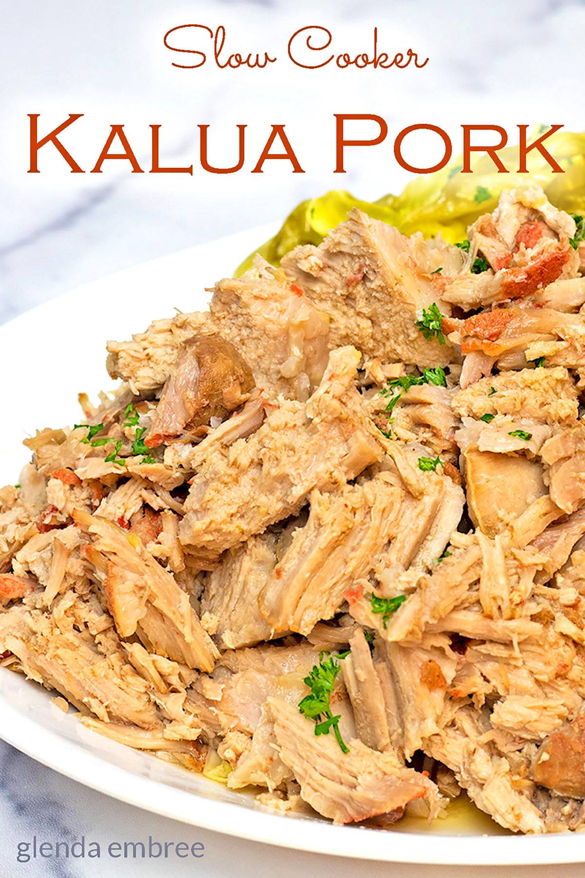 Slow Cooker Kalua Pork and Cabbage on a white platter.