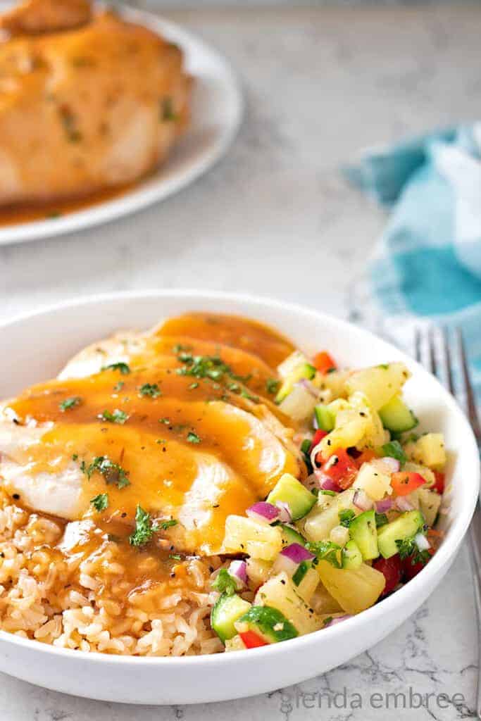 Pineapple Chicken Rice Bowls with Pineapple Salsa in white ceramic bowls.