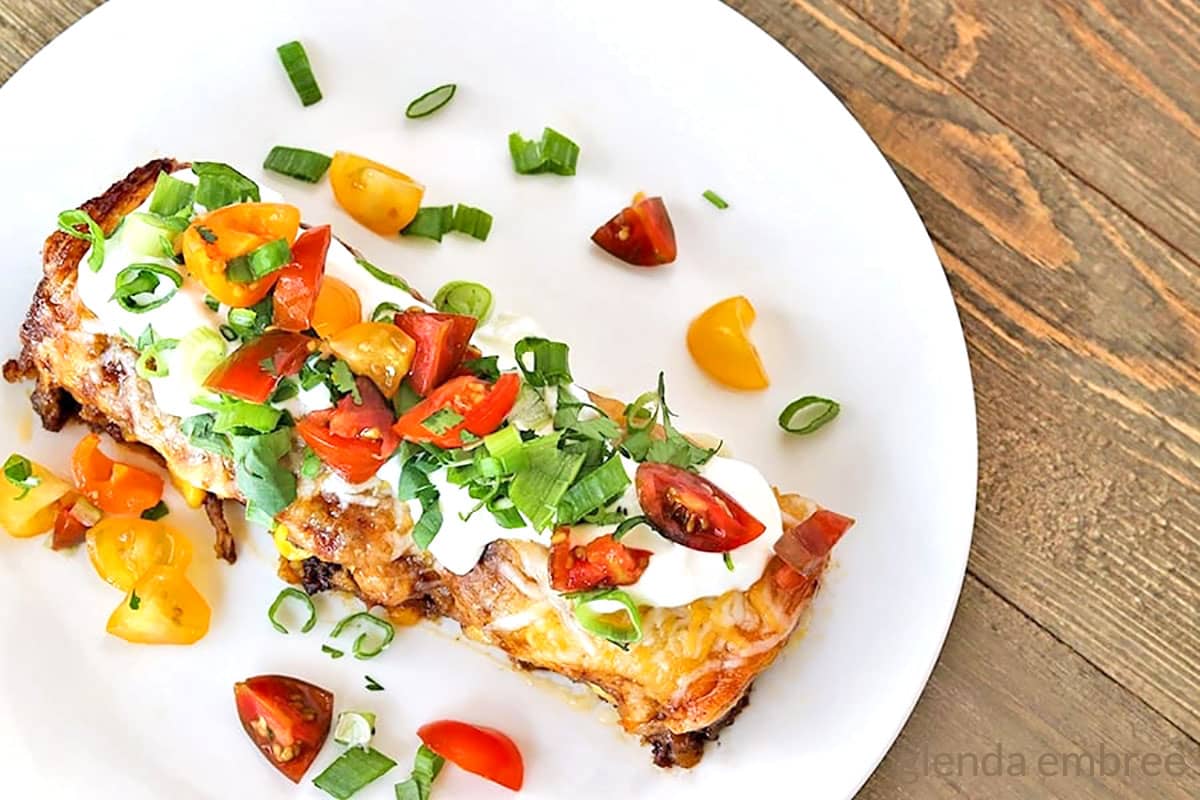 Beef enchilada casserole on a white plate.