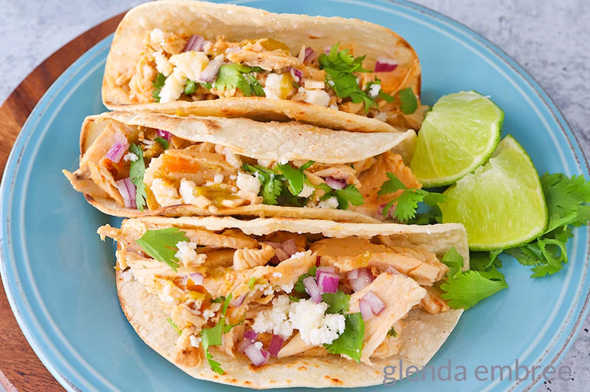 Chicken Street Tacos on a blue plate.