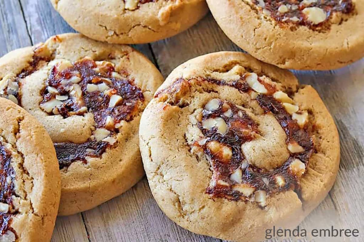 Date Pinwheel Cookies on a barn board tray.