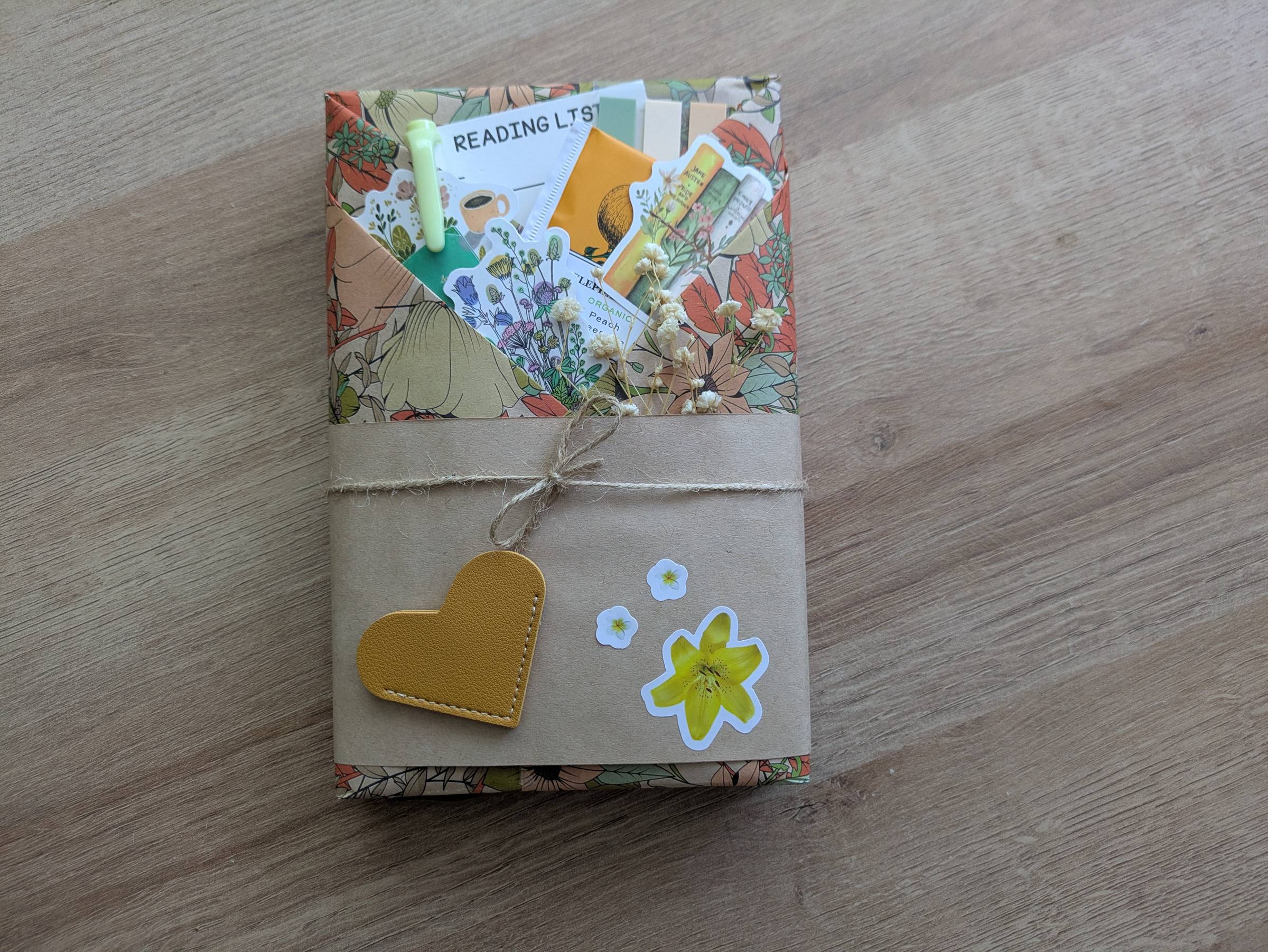 A book wrapped in colorful paper, twine, and stickers
