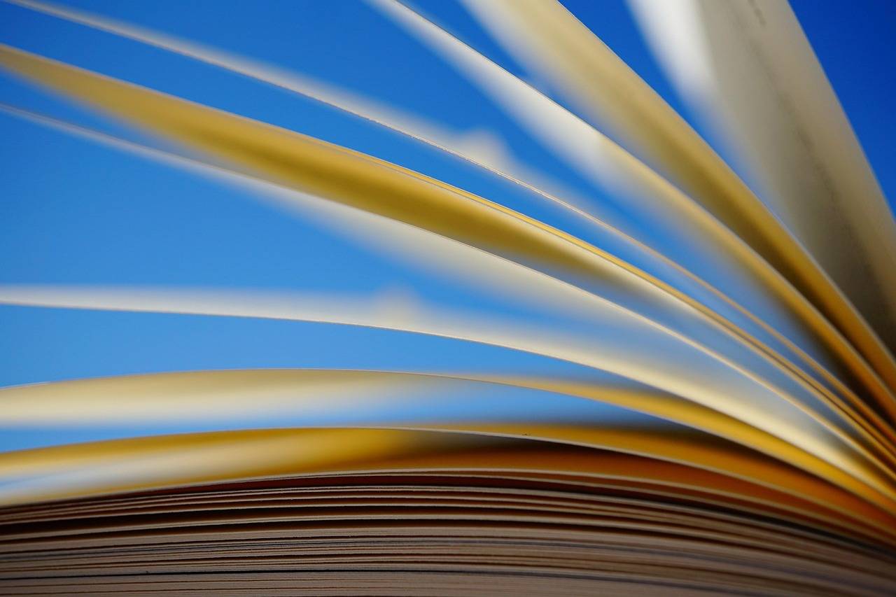 Book pages against a blue background