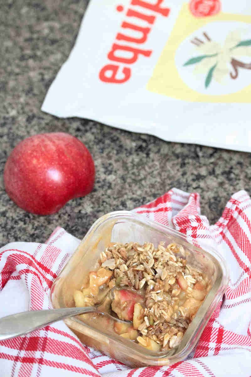 Protein apple crumble in a glass bowl.