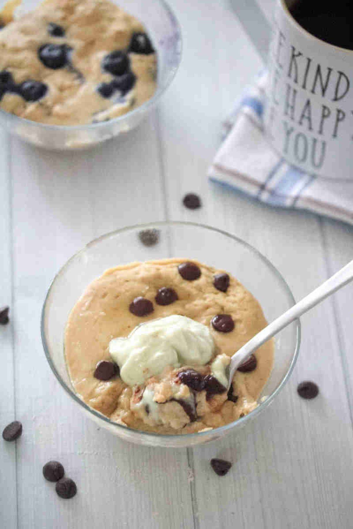 Pancake with chocolate chips in a glass bowl.
