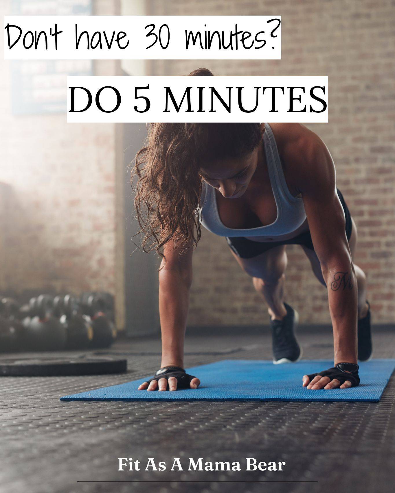 Woman in plank position on a blue mat.