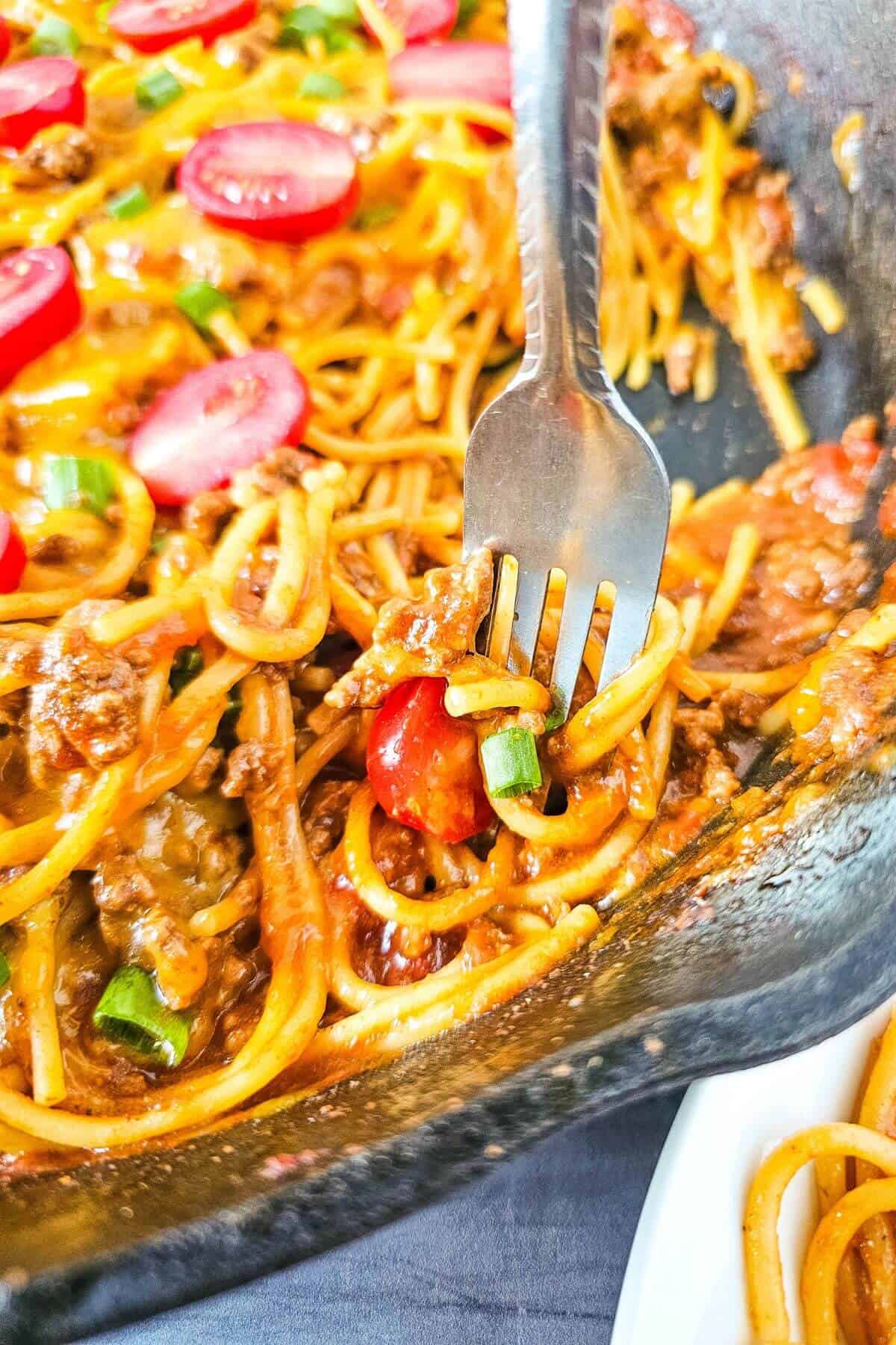 Taco spaghetti with a fork.