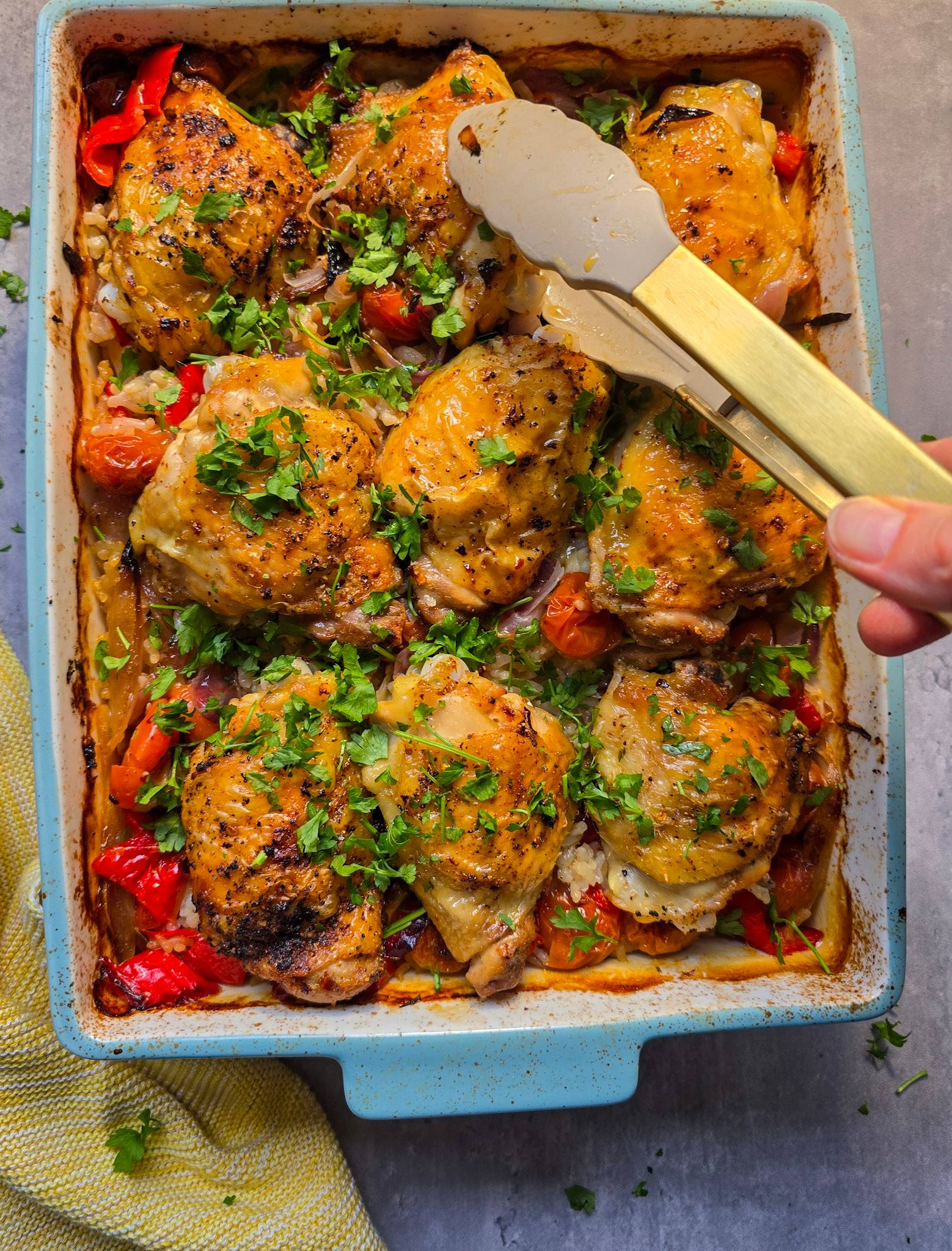 A casserole dish with Portuguese inspired peri peri chicken and rice.