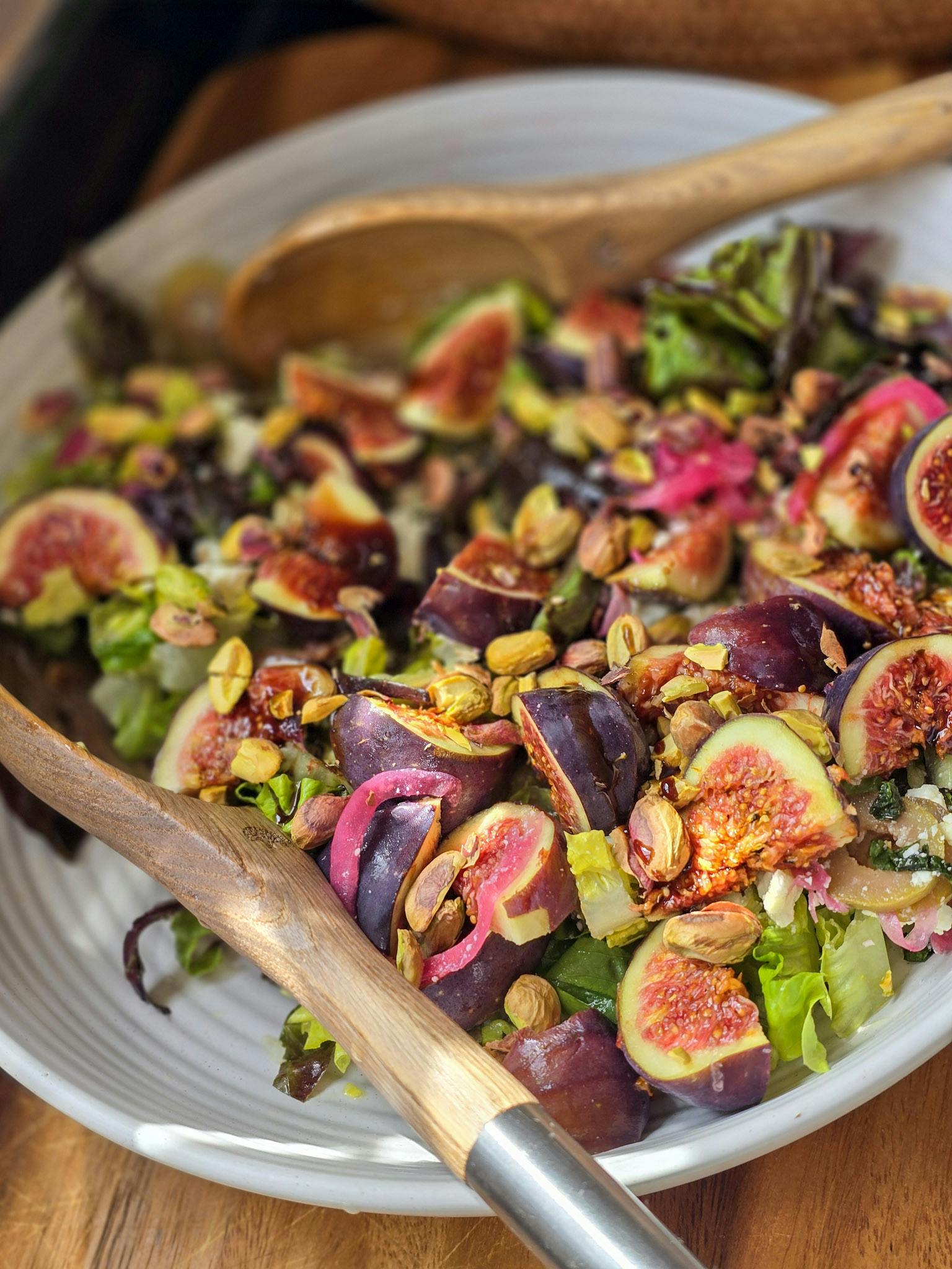 A salad with figs feta pistachios and pomegranate molasses 