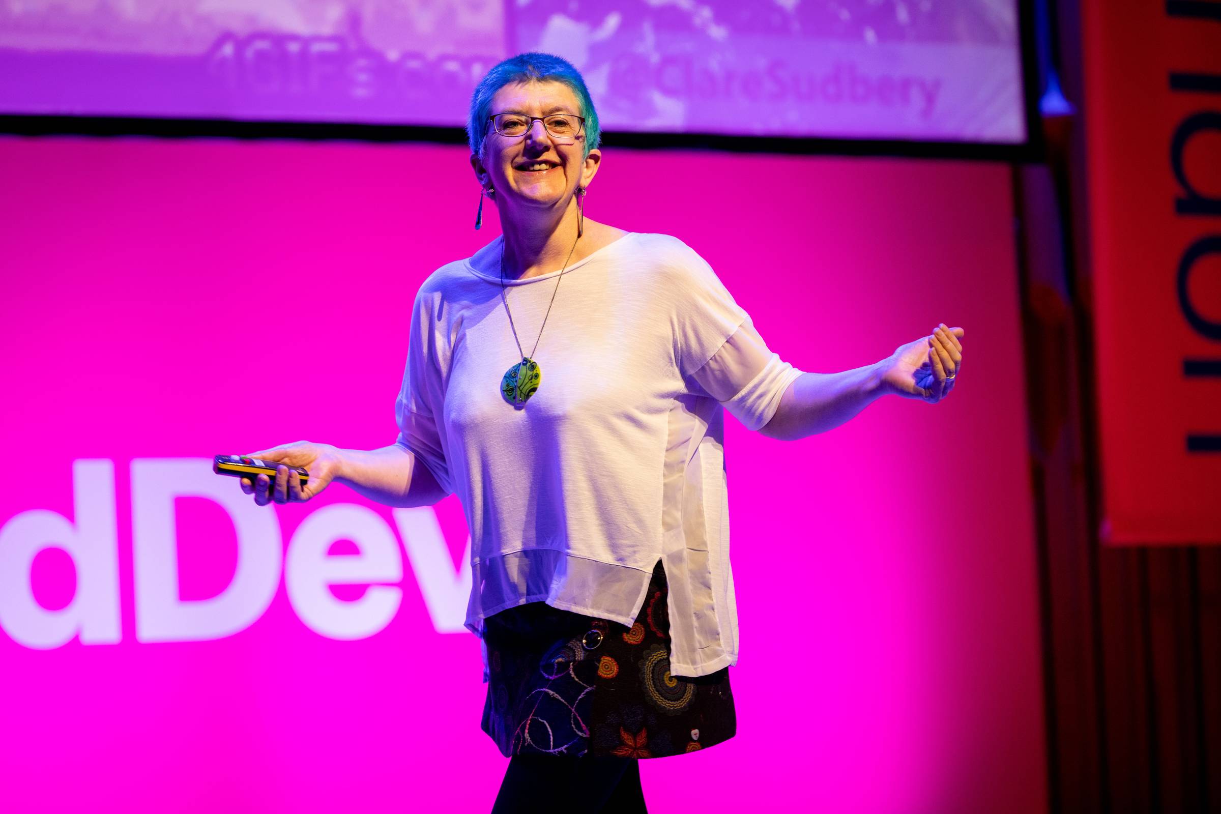 Clare (me!) on stage at Lead Dev London, looking very happy and excited