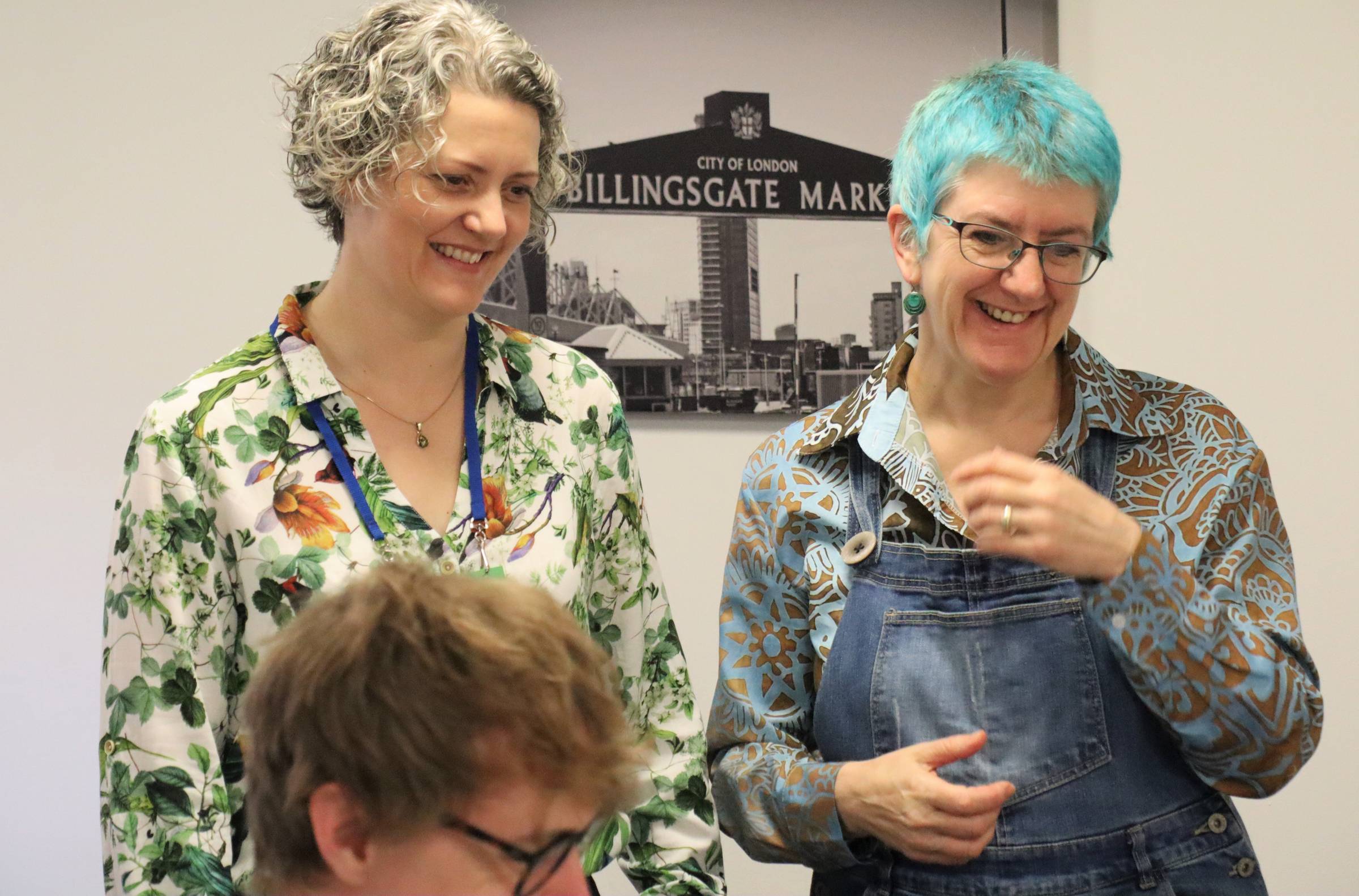 Emily Bache and Clare Sudbery smiling at some workshop participatsn