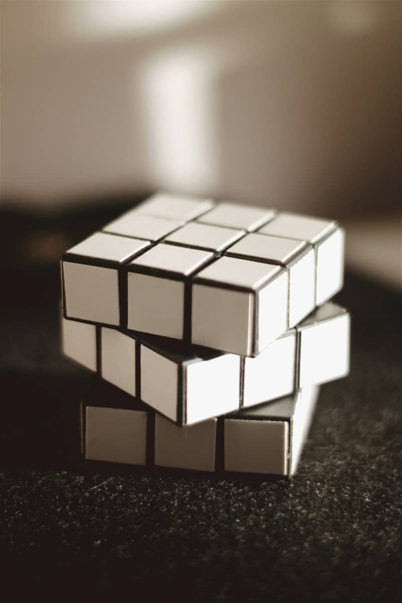 white and black 3 x 3 rubiks cube