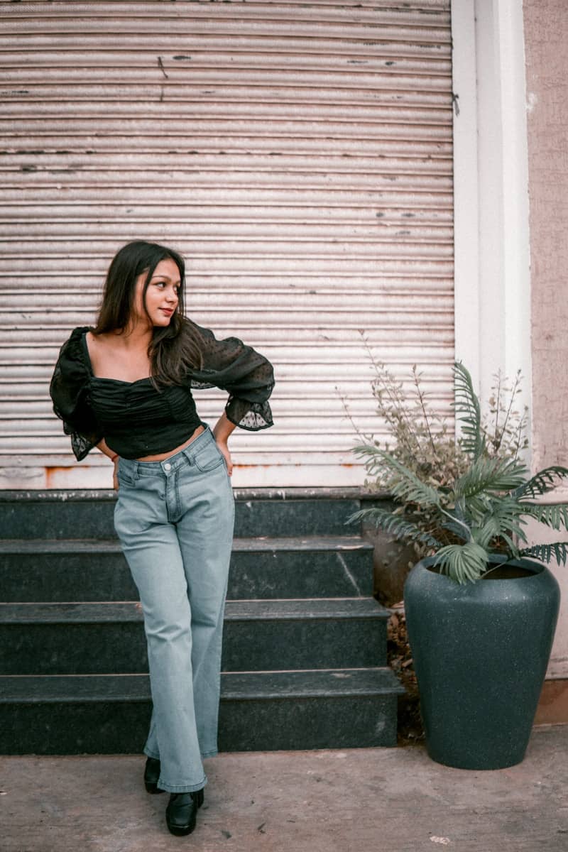 a person leaning against a wall