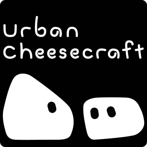 black logo with two cheese characters looking at each other words urban cheesecraft across top