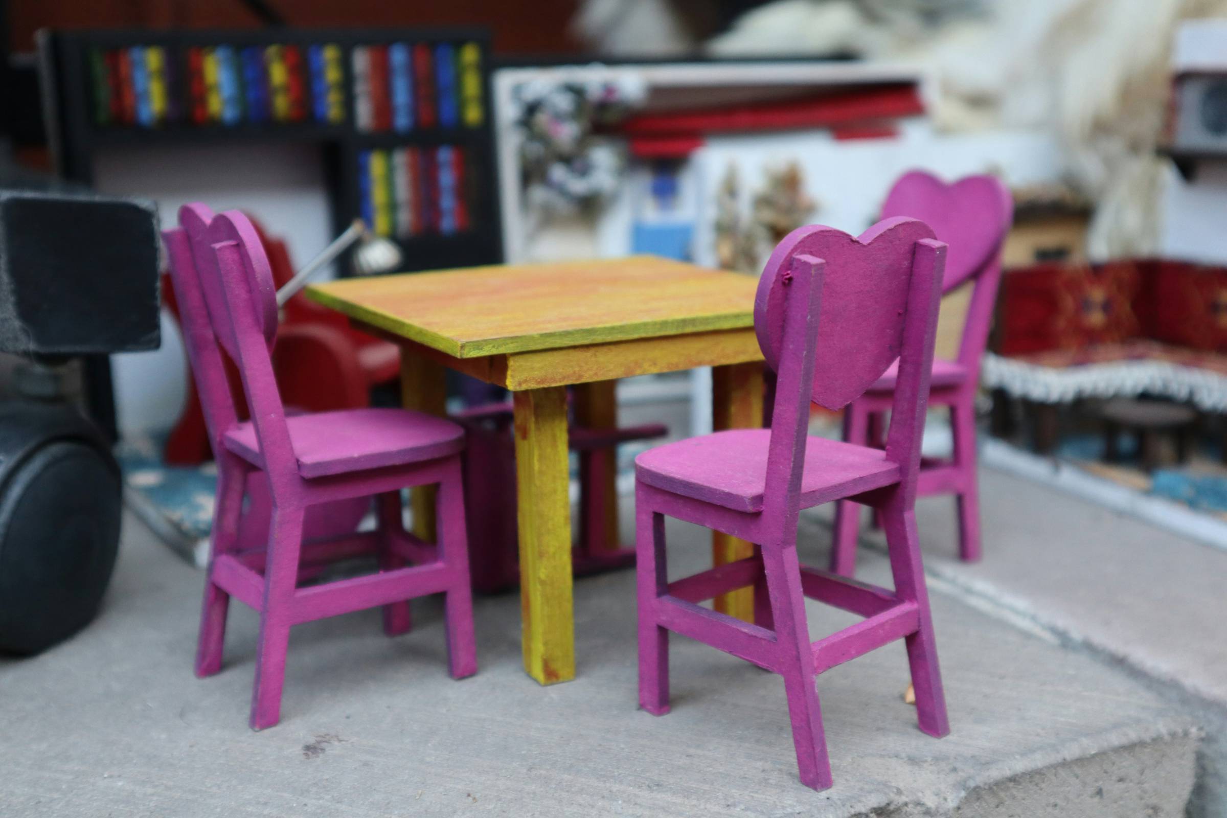 a dining table with purple chairs