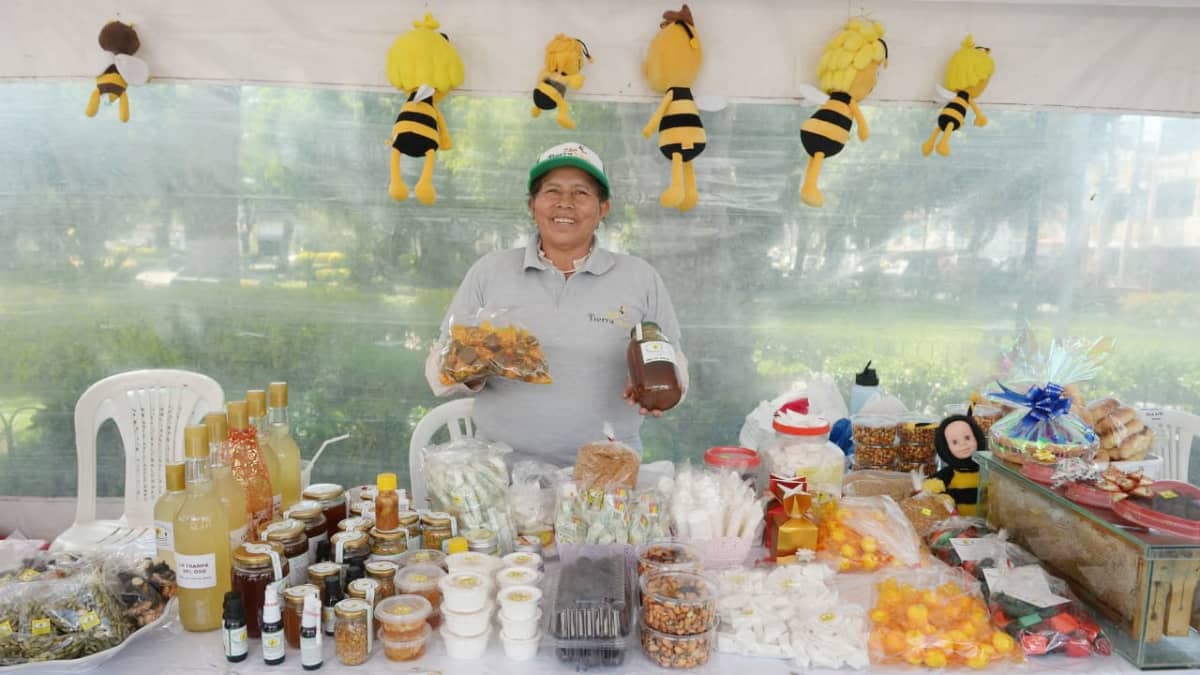 A vendor sells honey related products in Nayón, Ecuador